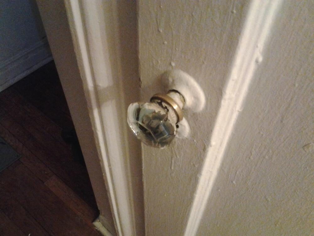 A closeup of a doorknob reveals a startling lack of detail from the camera.