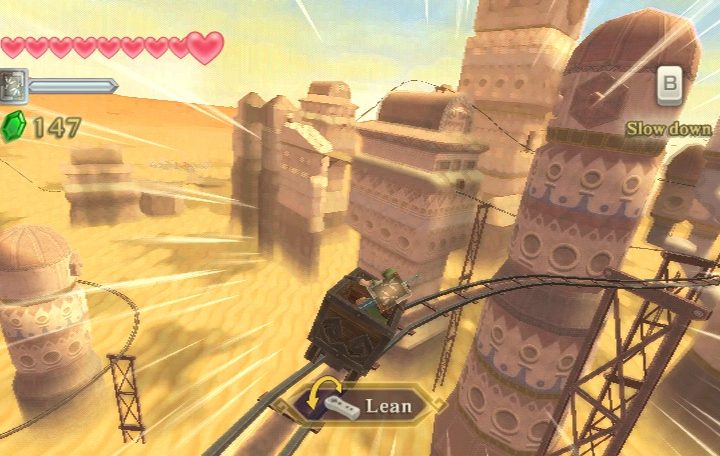 Link riding a minecart in the desert.