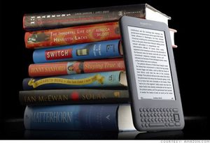 kindle against stack of books