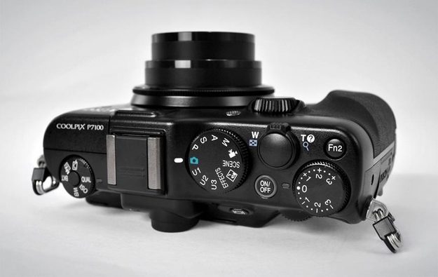 Nikon Coolpix P7100 digital camera review top angle point and shoot dials and controls manual customization