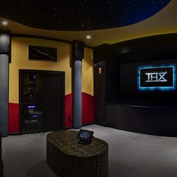 Photo of a home theater with THX logo on a screen.