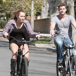 Miley Cyrus and boyfriend Liam Hemsworth go for a bike ride through her Toluca Lake, CA neighborhood