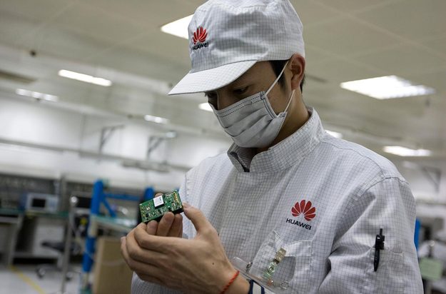 Huawei R&D staff performing routine maintenance at a testing center