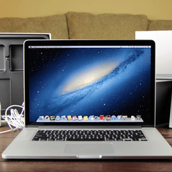 A MacBook Pro sitting on a table.