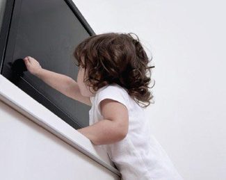 child-reaching-for-television