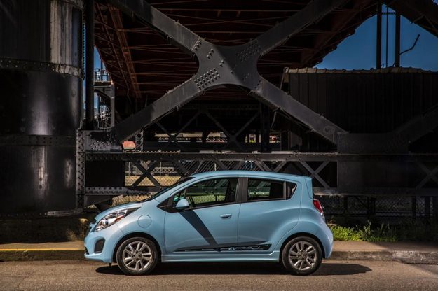 2014 Chevrolet Spark EV profile under a bridge