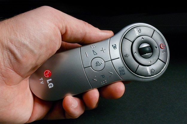 LG 65LA9700 4KTV remote in hand