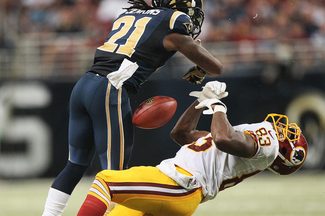 St. Louis Rams cornerback Janoris Jenkins lays a hit on Washington's Fred Davis.