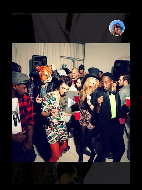 Photo 2: People dancing at a party clutching red solo cups