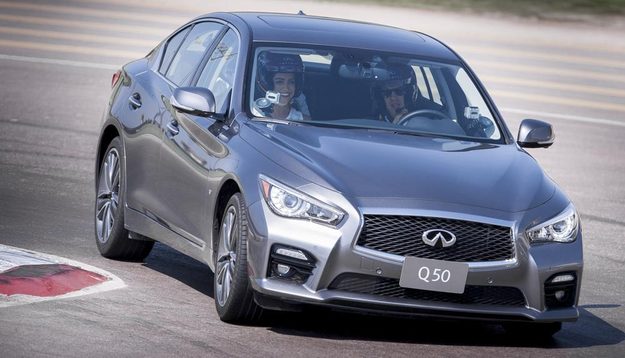 Sebastian Vettel driving 2014 Infiniti Q50