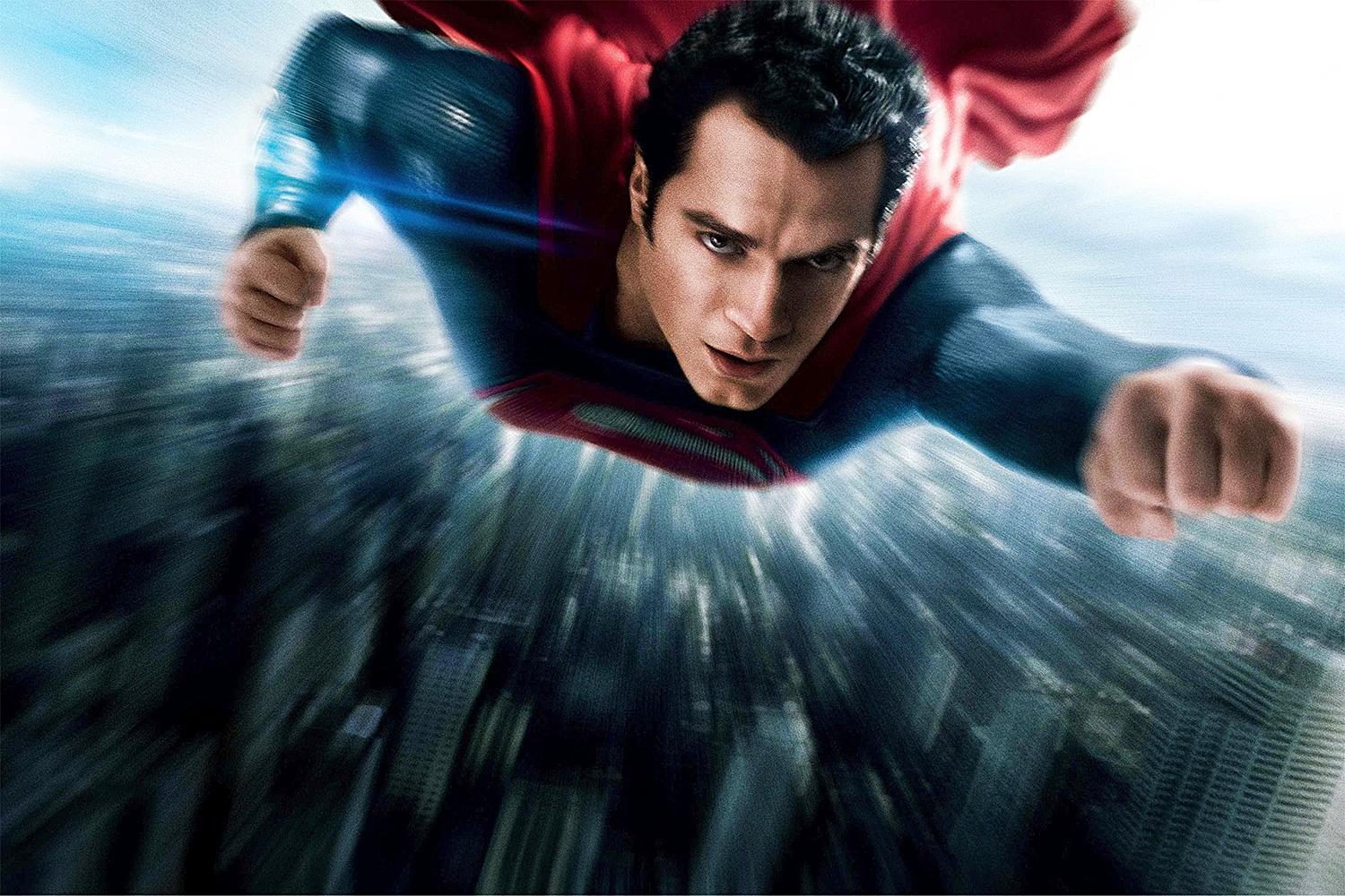Henry Cavill as Superman flying in a poster for Man of Steel.