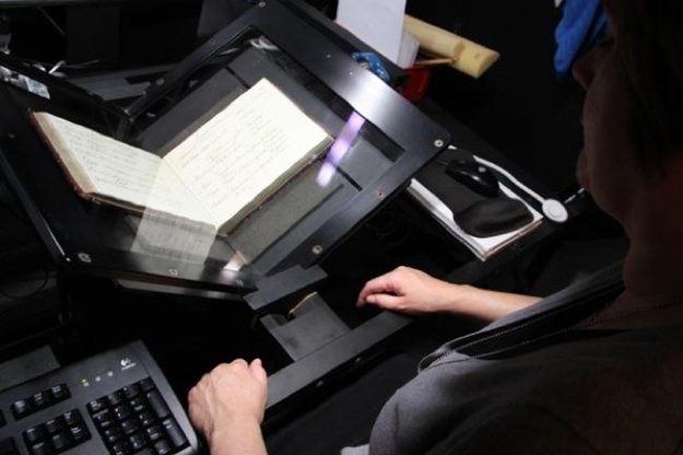 Getty Research Institute's Richinda Brim uses scanning equipment for digitizing pieces from Getty's collection. (J. Paul Getty Trust)