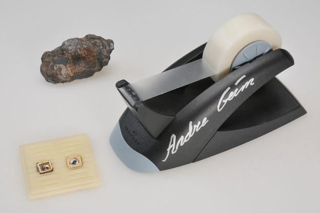 The graphite lump, graphene transistor and tape dispenser that Andre Geim and Konstantin Novoselov donated to the Nobel Museum.