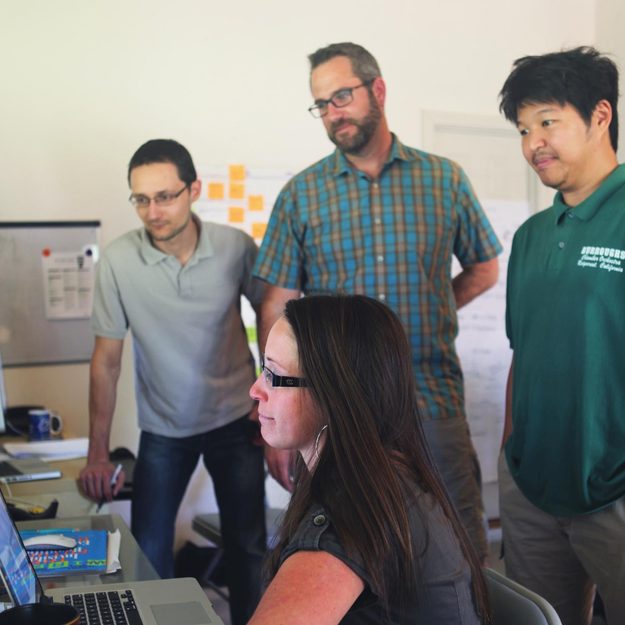 Chad Newell, a stock photo agency veteran and founder of Snapwire, reviews submissions with his team.