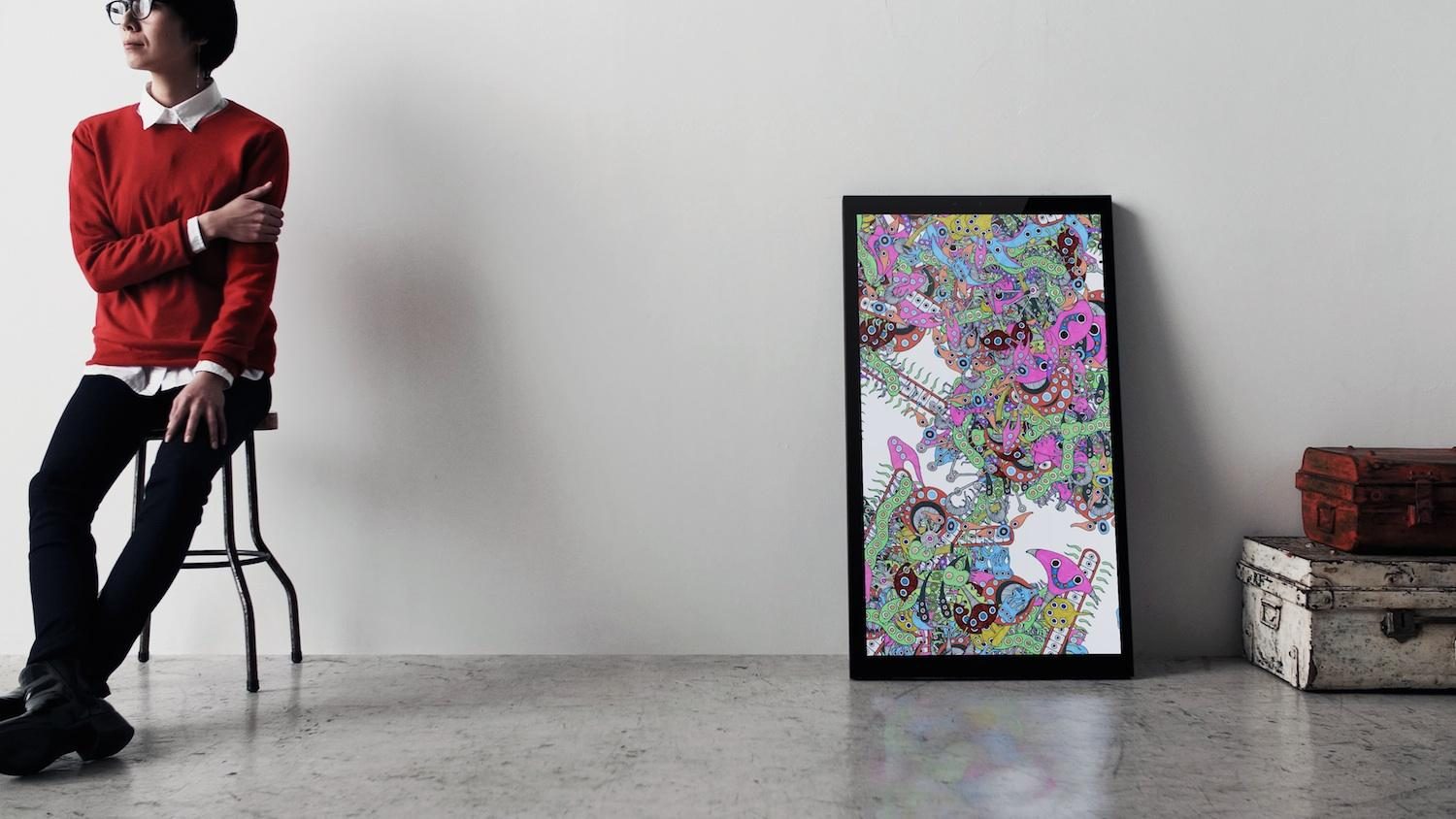 framed digital canvases kickstarter on chair in front of with pink art high res