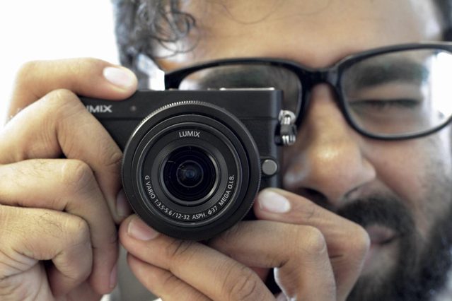 Our friend Chris Gampat of The Phoblographer modeling the small camera for us.