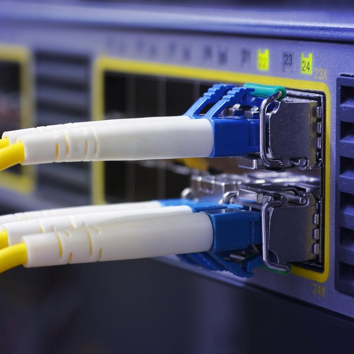 Multiple cables plugged in to a server.