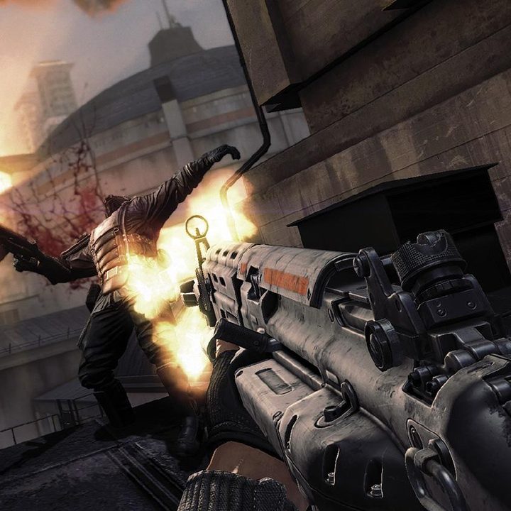 BJ shooting a nazi in the face with a machine gun.