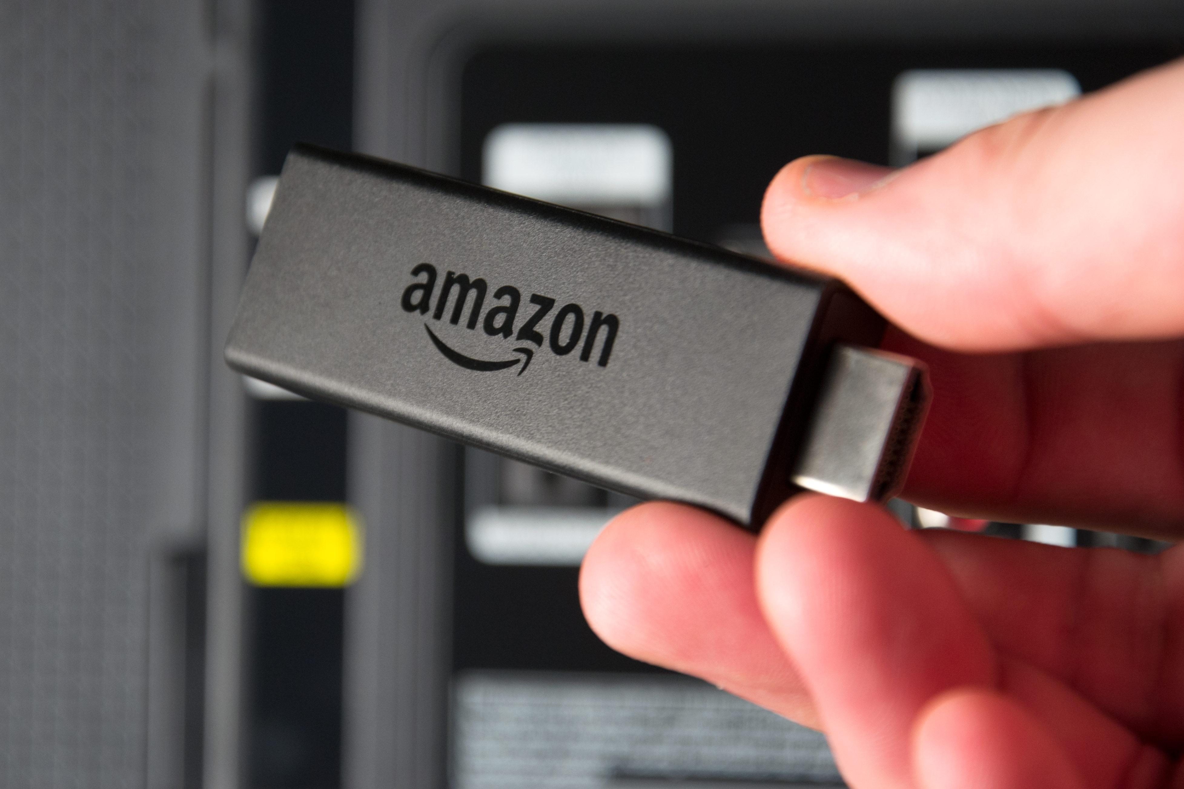 Amazon Fire TV Stick in hand