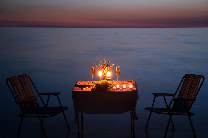 Step Three: Reserve a table or plan a romantic dinner at home