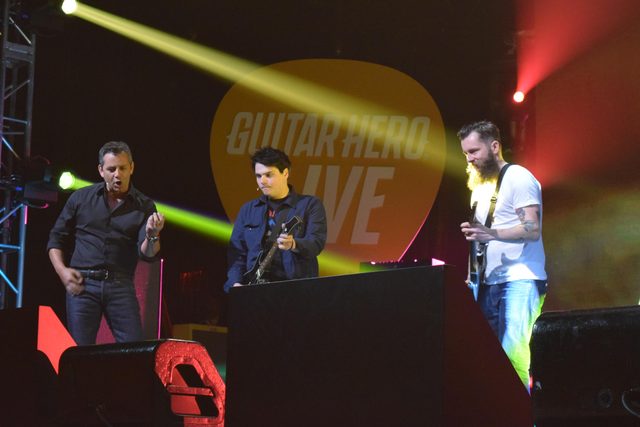 My Chemical Romance's Gerard Way duels with FreeStyleGames' Jamie Jackson while Activision Publishing CEO Eric Hirshberg rocks out nearby