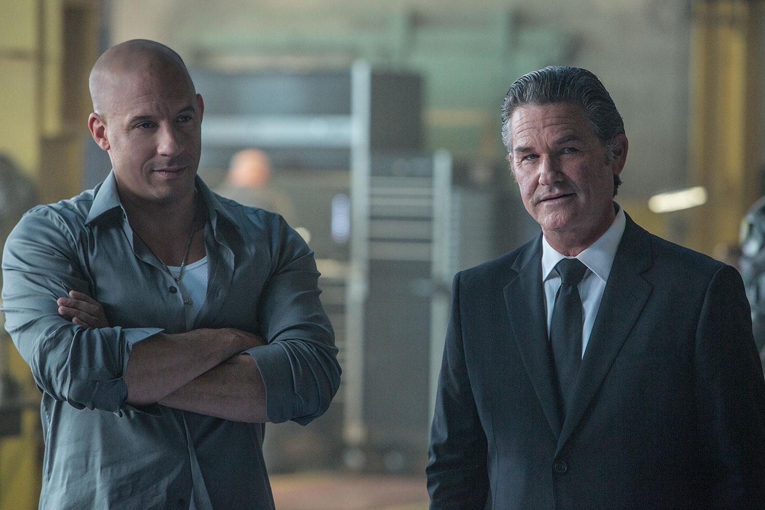Vin Diesel stands next to Kurt Russell in Furious 7.