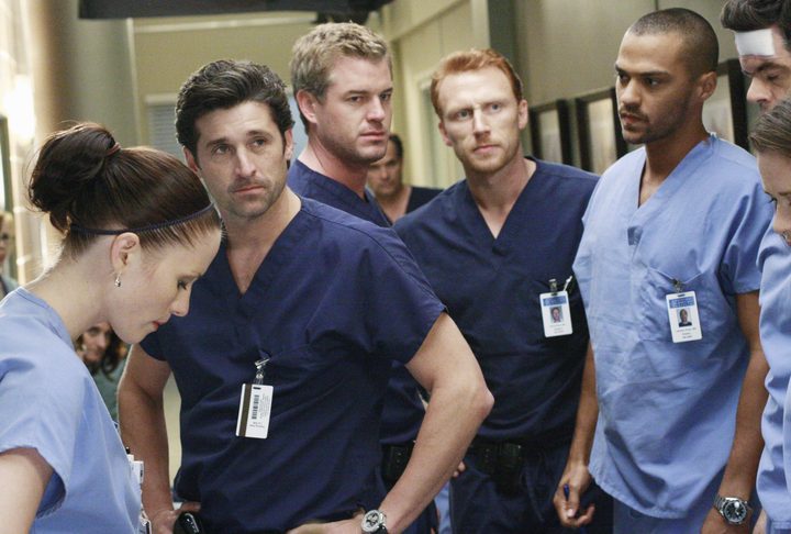Doctors from Grey's Anatomy in a hallway.