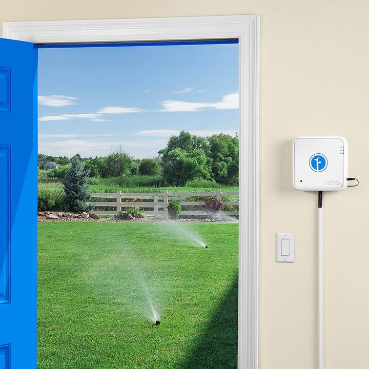 Rachio IRO smart sprinkler installed on wall.