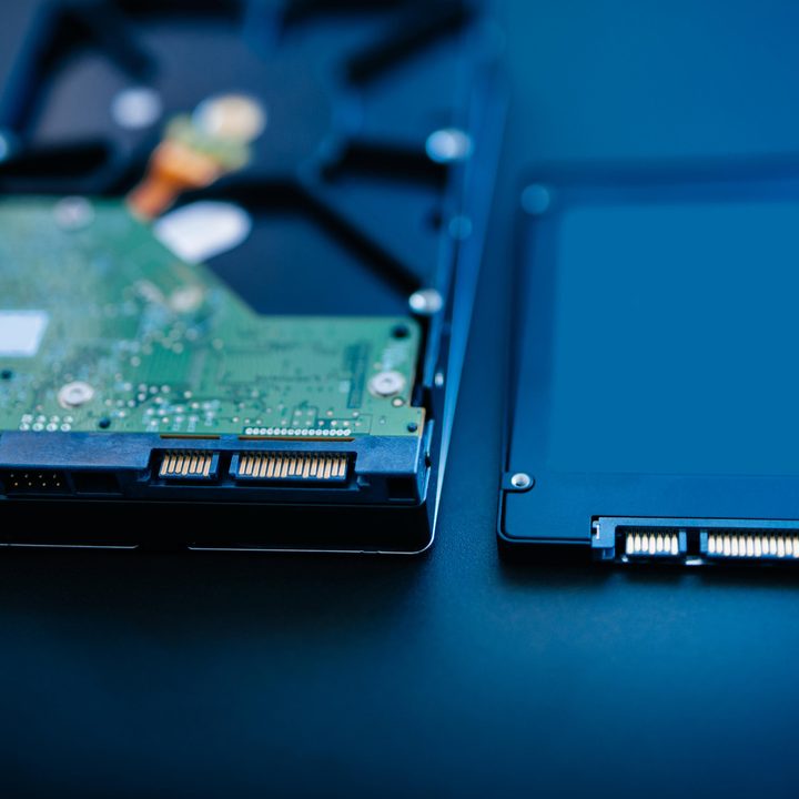 A hard drive disk and an SSD side by side.