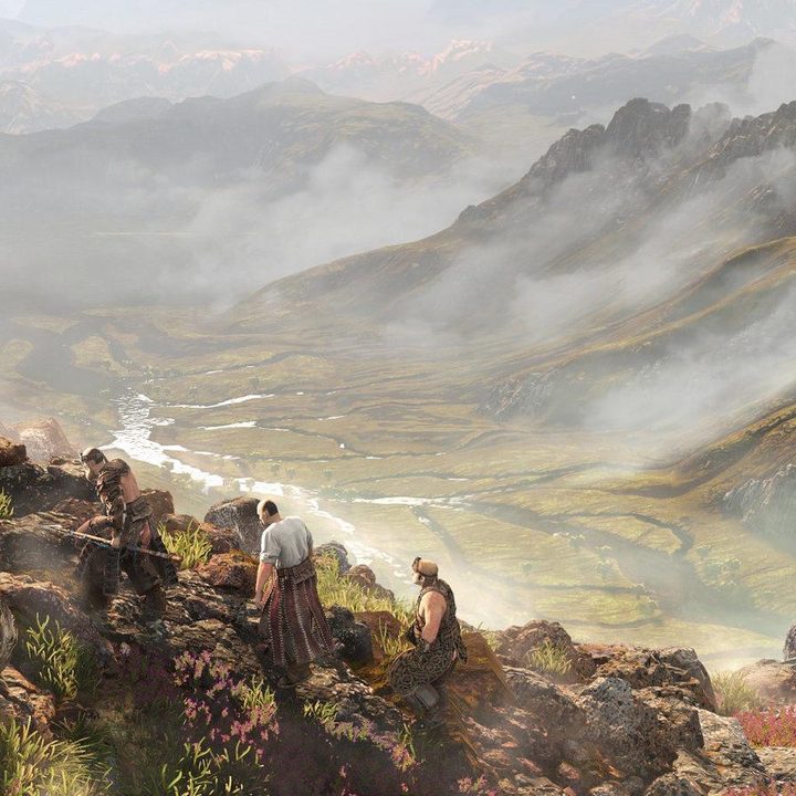 A line of men walking on a mountain ridge.