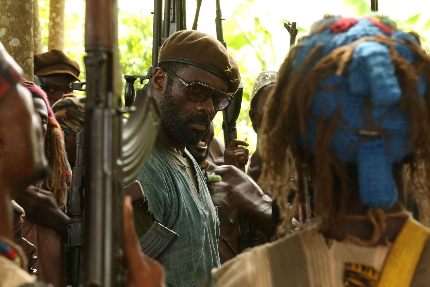 Idris Elba and kids in Beasts of No Nation.