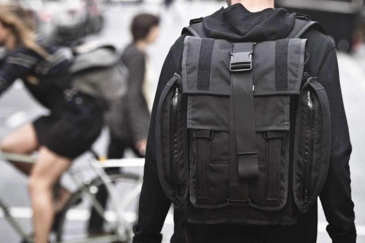 Another rear view of a person wearing a Mission Workshop&nbsp;R6 Arkiv Field Pack.