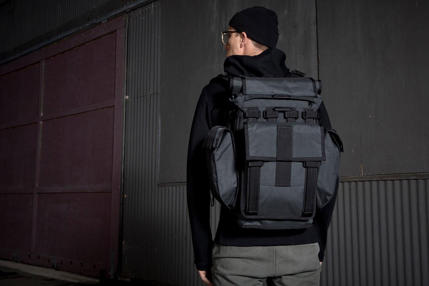 Rear view of a person wearing a Mission Workshop&nbsp;R6 Arkiv Field Pack.