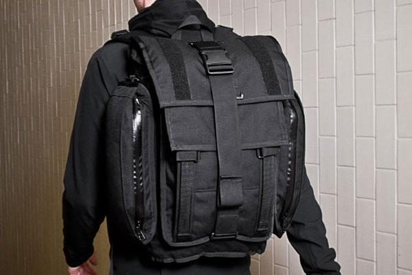 Another close up profile rear view of a person wearing a Mission Workshop&nbsp;R6 Arkiv Field Pack, from a different angle.