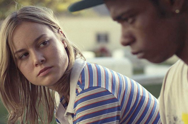 Brie Larson sits next to LaKeith Stanfield and stares in Short Term 12.