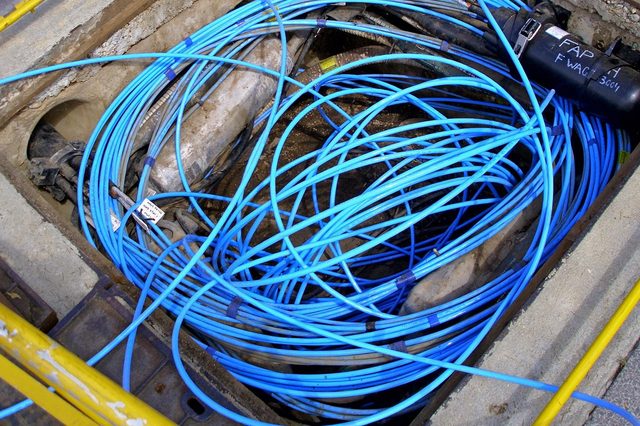 Fibre-optic_cable_in_a_Telstra_pit-Cropped