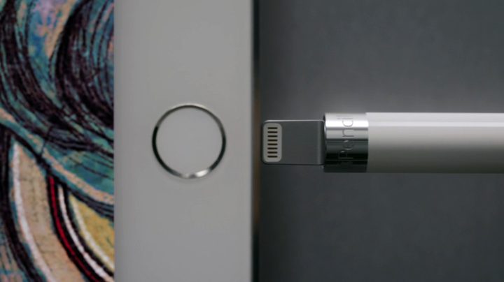 First-generation Apple Pencil being plugged into an iPad.