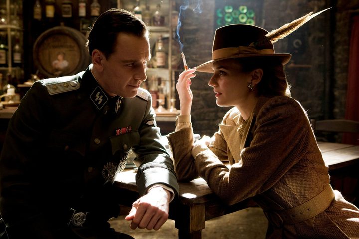 A man and a woman talk in Inglourious Basterds.