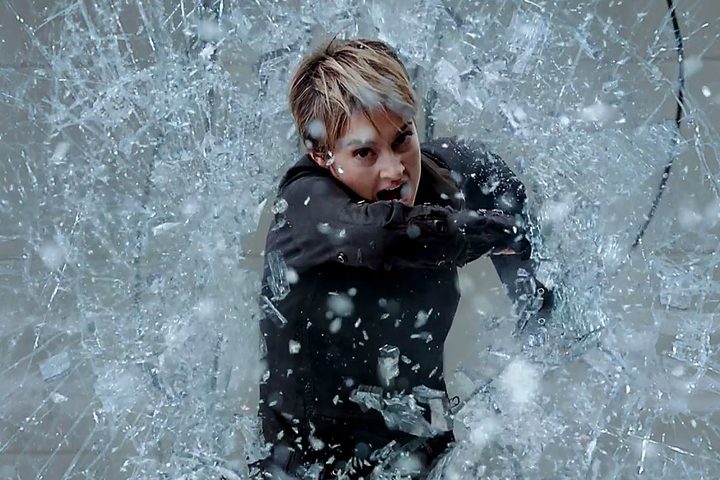 Shailene Woodly bursts through glass in Insurgent.