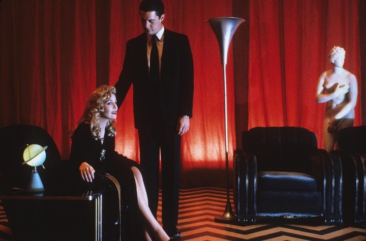 A scene showing a woman and man in a room in Twin Peaks.