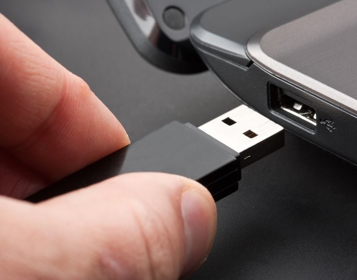 Flash drive going into USB port.