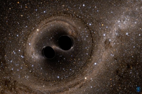 A computer simulation showing two black holes colliding with one another