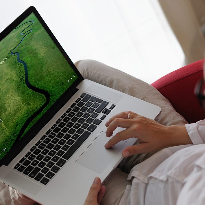 A person using a laptop with Windows Hello.
