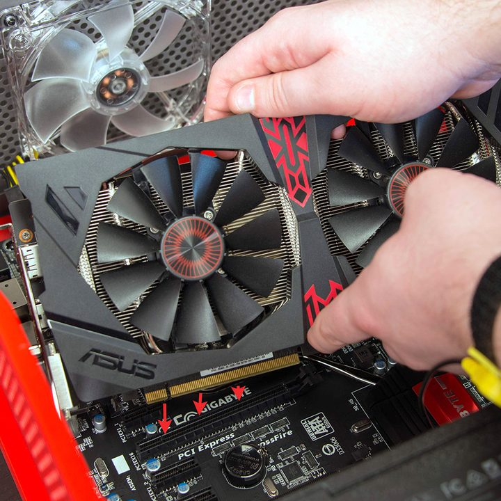 Installing a graphics card into the PCIexpress slot.