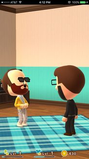 Two Miitomo users chuckle together.