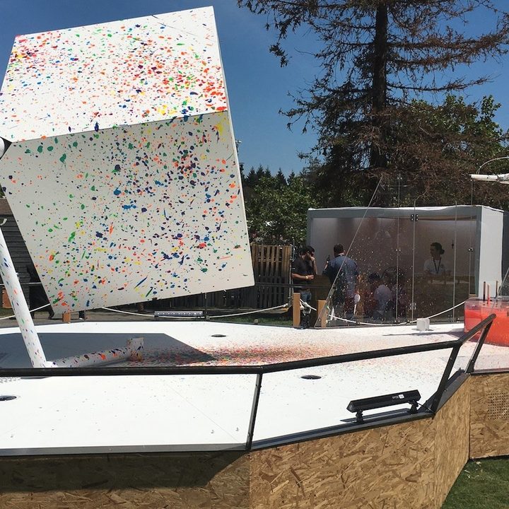 A robot painting a cube