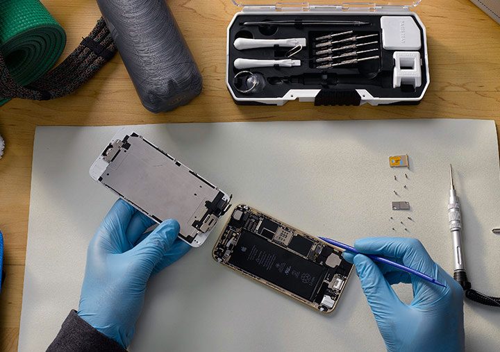 An iPhone being repaired.