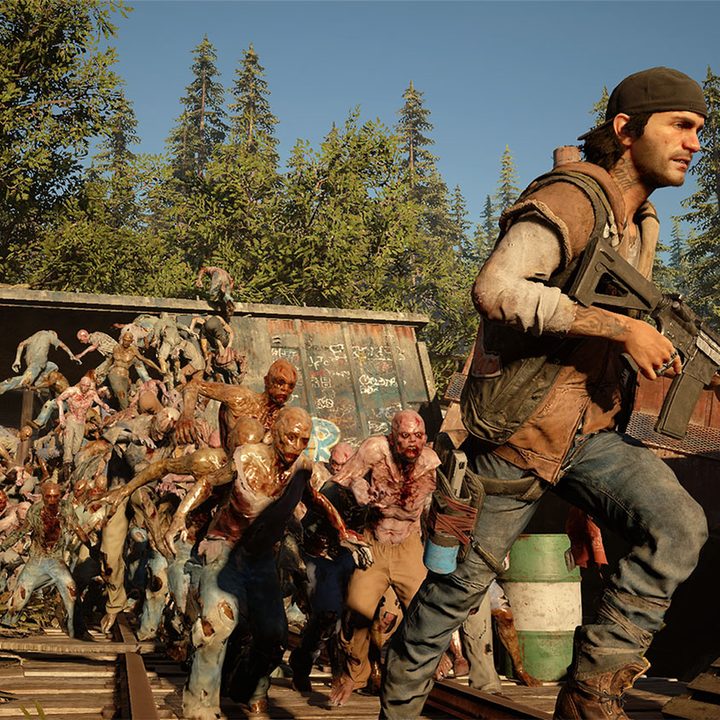 Days Gone's Deacon runs from a horde of zombies.