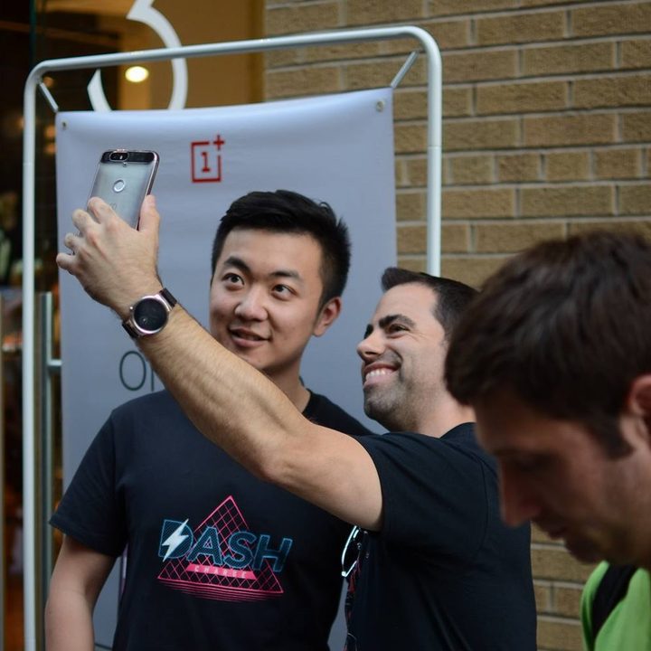 Carl Pei takes a selfie at a OnePlus event.