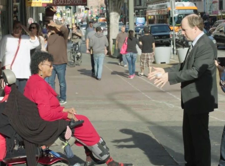 The woman in the wheelchair tells J.D. Walsh she's willing to be in the film.